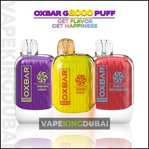 Three Colorful Oxbar G8000 Disposable Vape Devices In Sakura Grape, Mango Peach, And Sunset Watermelon Flavors Against A White Background.